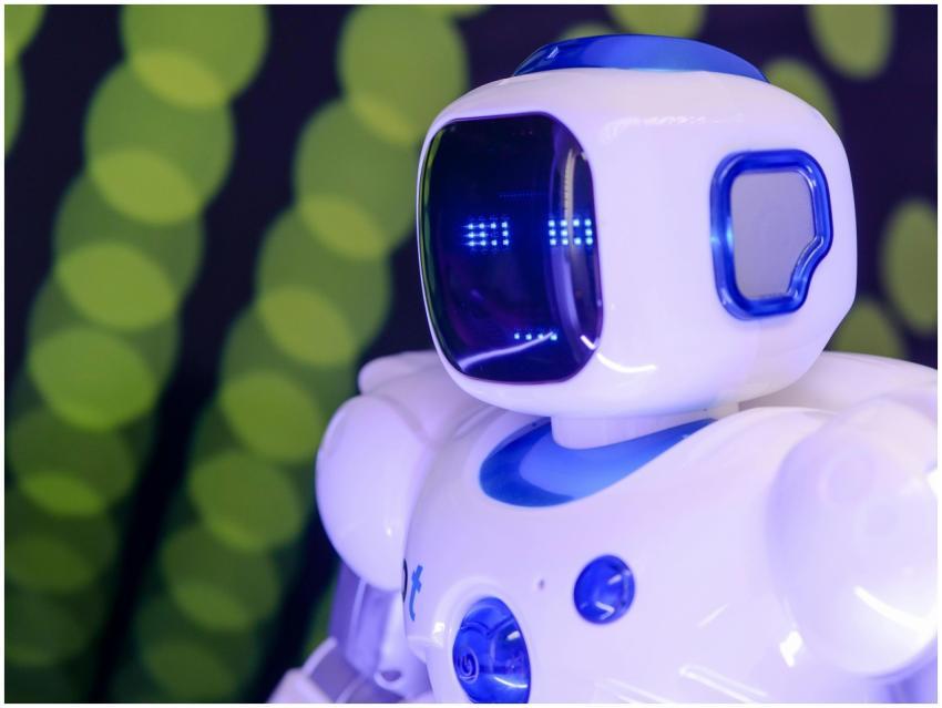 Close-up of a modern humanoid robot with glowing b