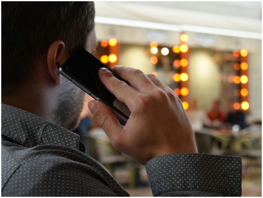 Close-up of a businessman in a dotted shirt making