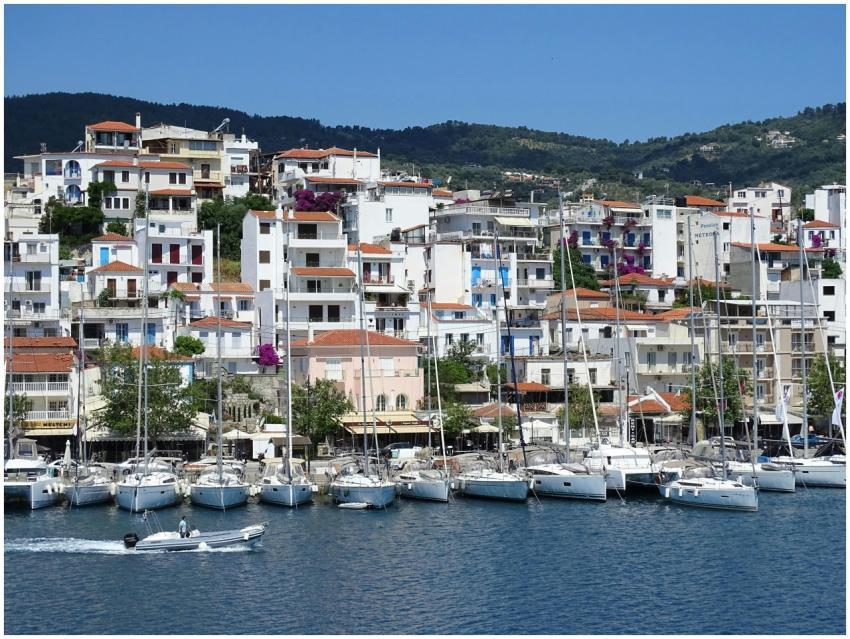 Colorful harbor scene in Skiathos, Greece, with do