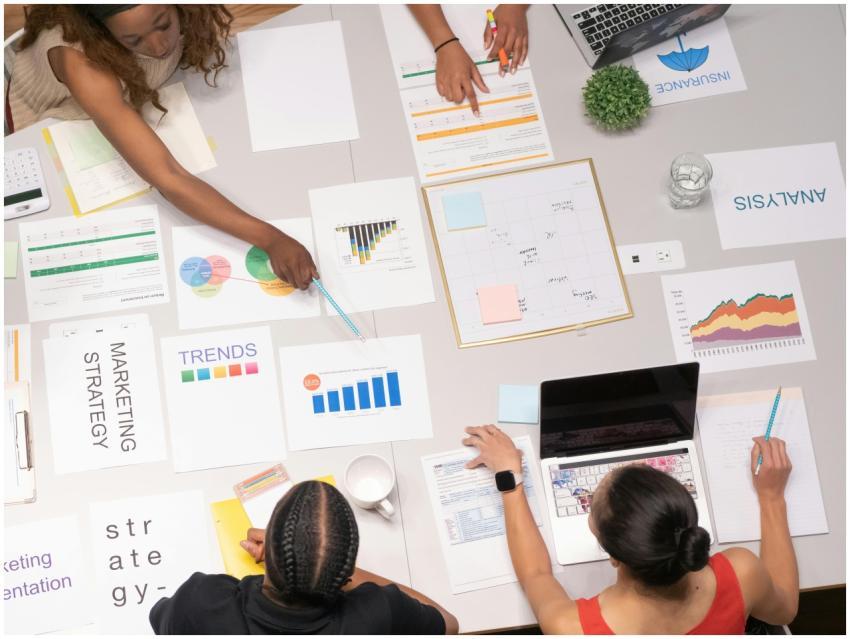 Top view of a team collaborating on marketing stra