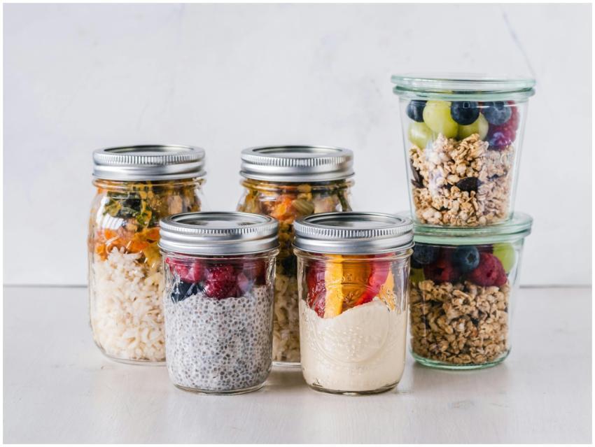 Close-up of healthy food jars containing granola,