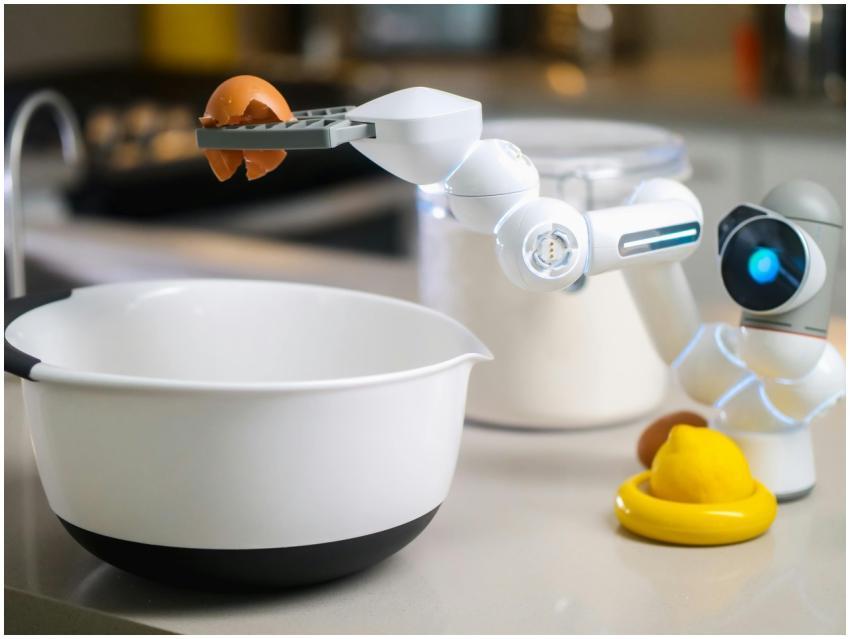 A robotic helper cracks an egg into a bowl in a co