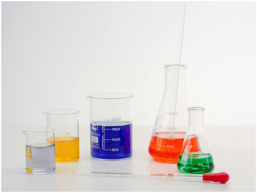 Laboratory glassware with colorful liquids, ideal