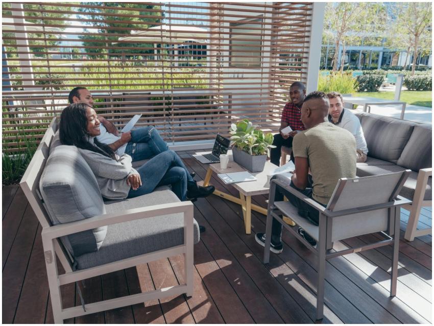 Diverse team having a collaborative meeting outdoo