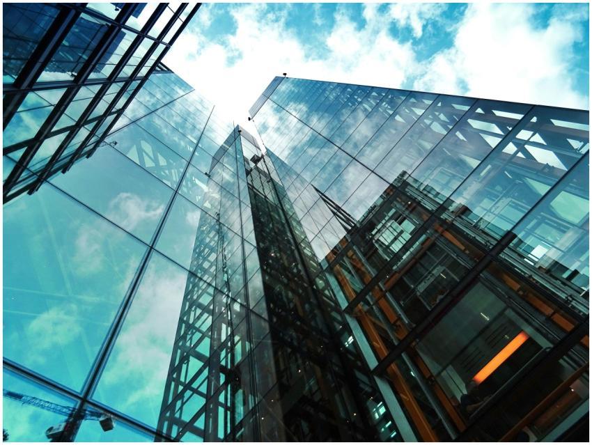 A striking view of a modern glass skyscraper refle