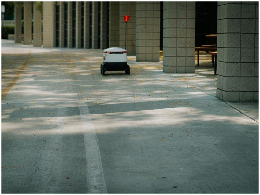 Futuristic autonomous robot on a delivery mission