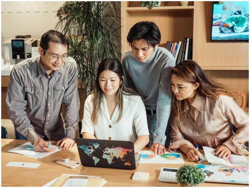 A diverse group of professionals collaborating ove