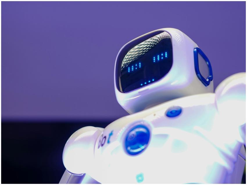 A modern humanoid robot with digital face and lumi