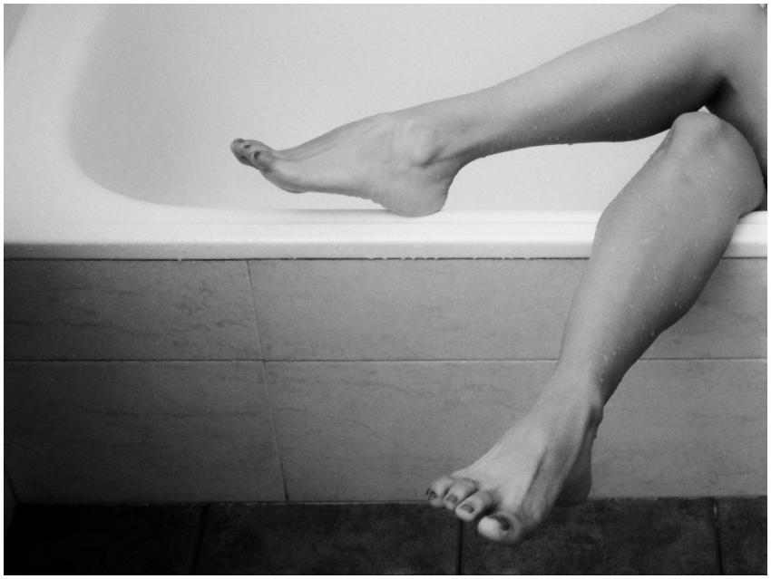 Black and white image of legs gracefully resting o