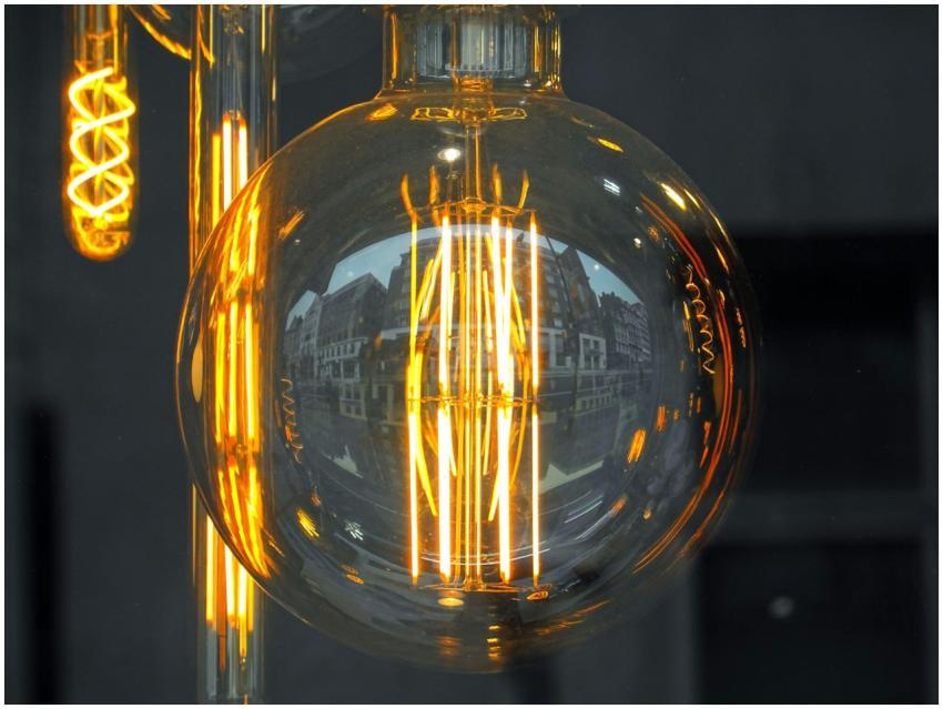 Close-up of an Edison style light bulb reflecting