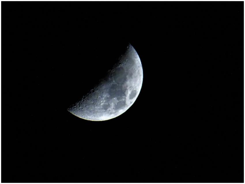 Captivating crescent moon visible against a dark n