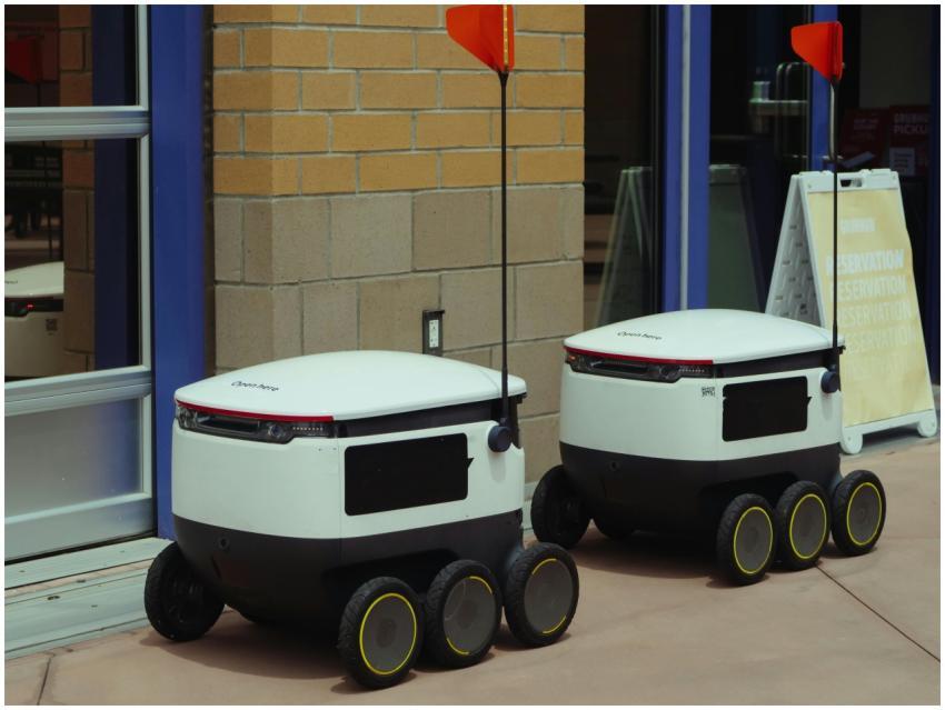 Autonomous delivery robots outside building ready