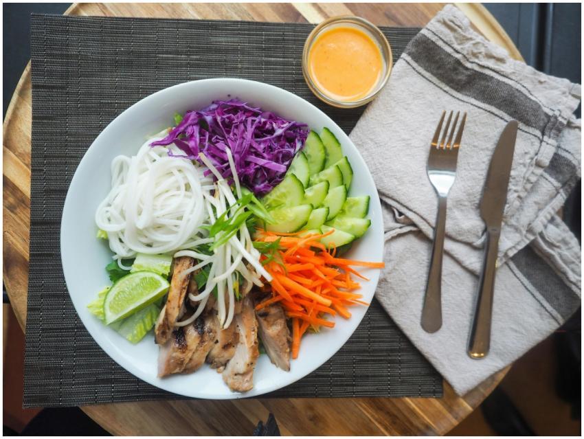 Vibrant Vietnamese noodle bowl with chicken, fresh