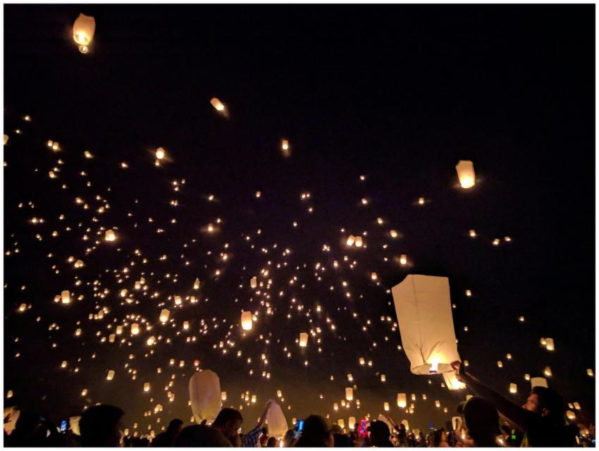A breathtaking view of floating lanterns illuminat