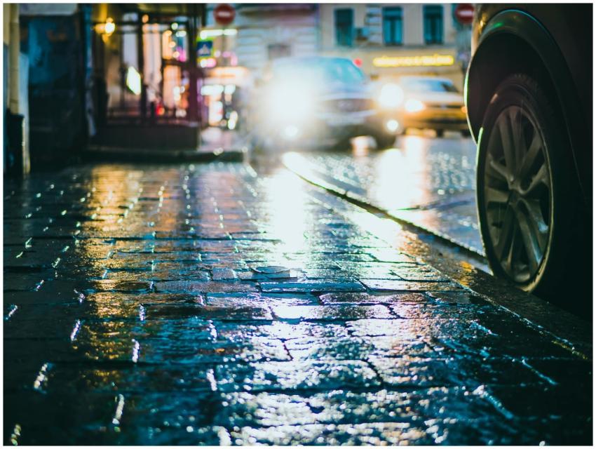 Long exposure of a wet city street with car headli
