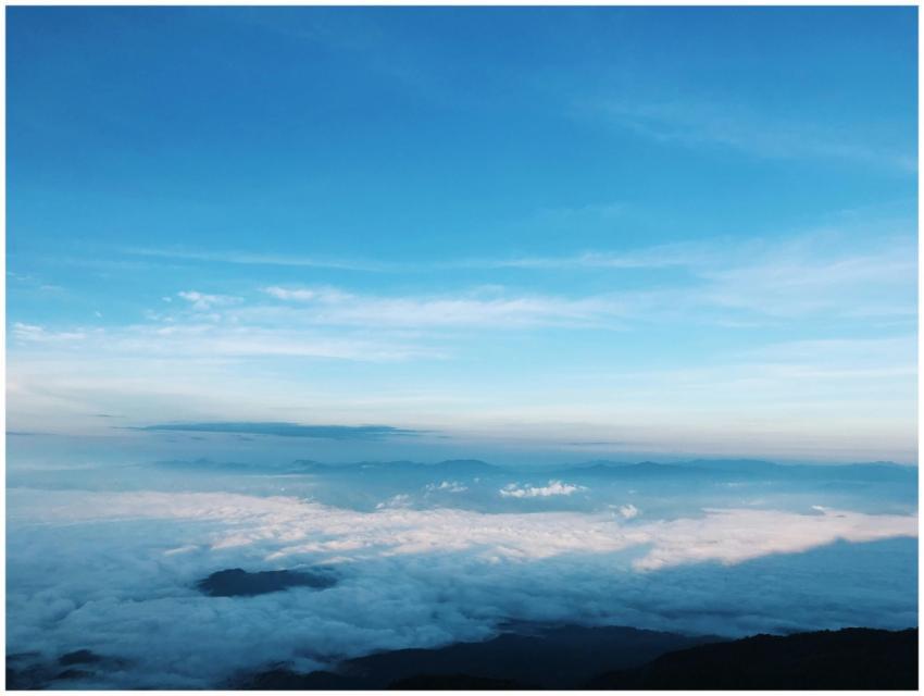 A breathtaking aerial view of fluffy clouds beneat