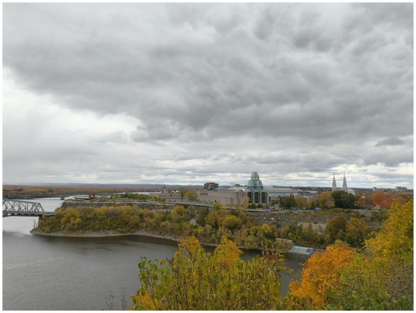 Overcast autumn view of Ottawa skyline featuring r