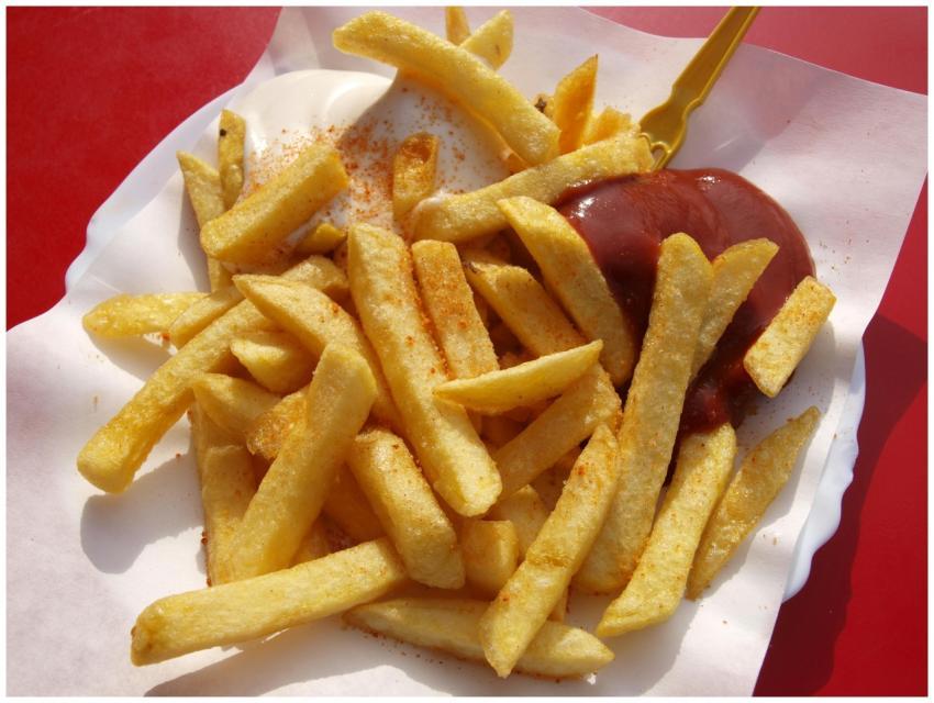 Delicious crispy French fries served with ketchup