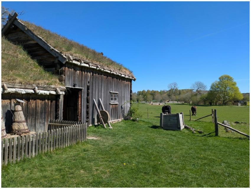 A picturesque rural scene with a wooden farmhouse