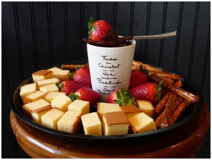 A tray of delicious chocolate fondue with strawber