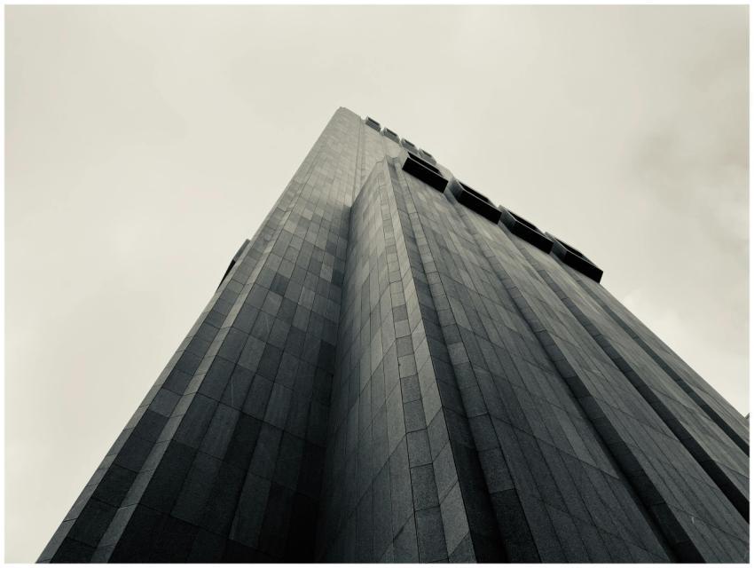 Dramatic black and white photo of a brutalist skys