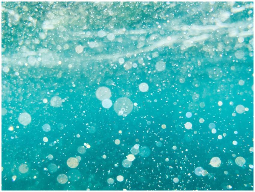 A captivating close-up of bubbles underwater, show