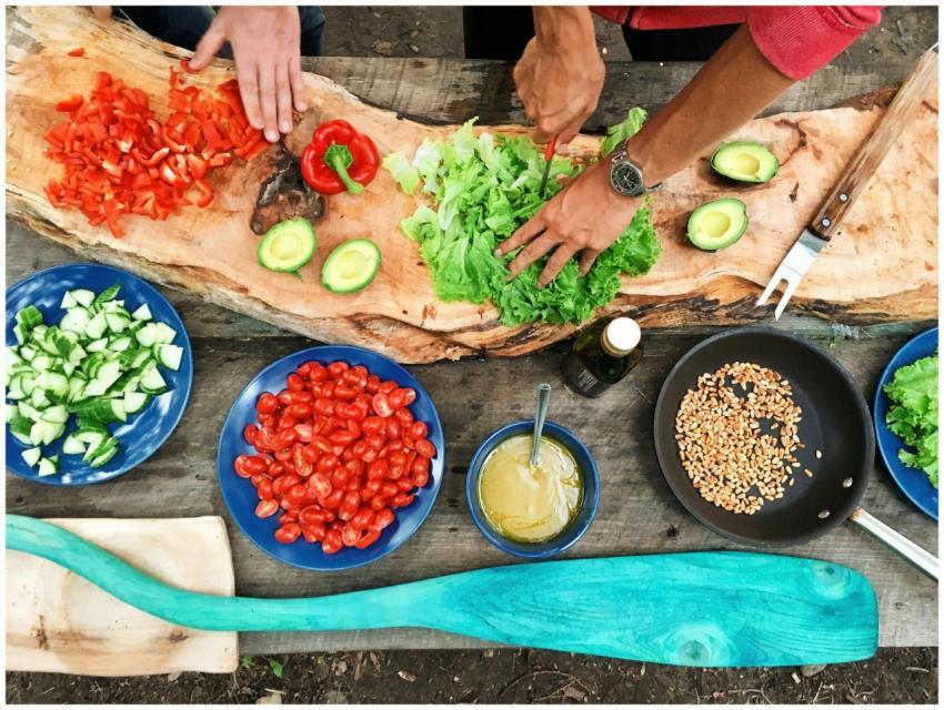 Fresh ingredients being prepared on a rustic woode
