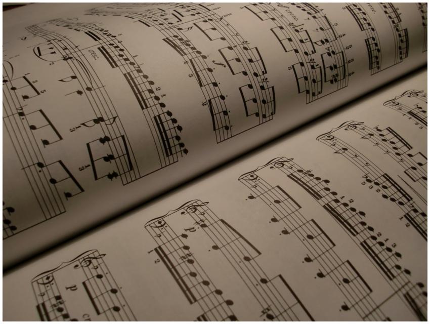 Detailed view of an open music book displaying mus