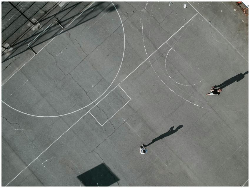 Aerial view of a basketball court with two players