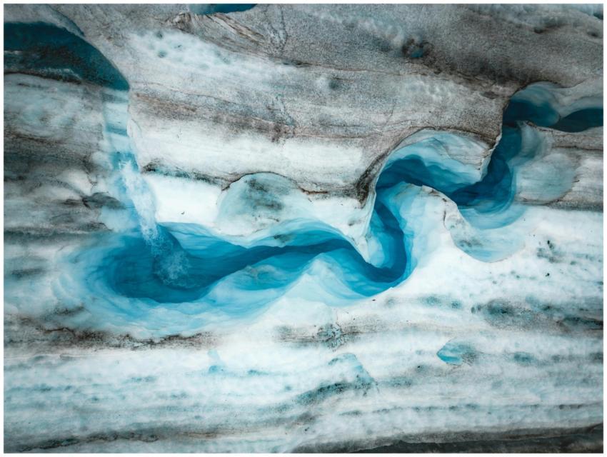 Stunning aerial view of a winding glacier with vib