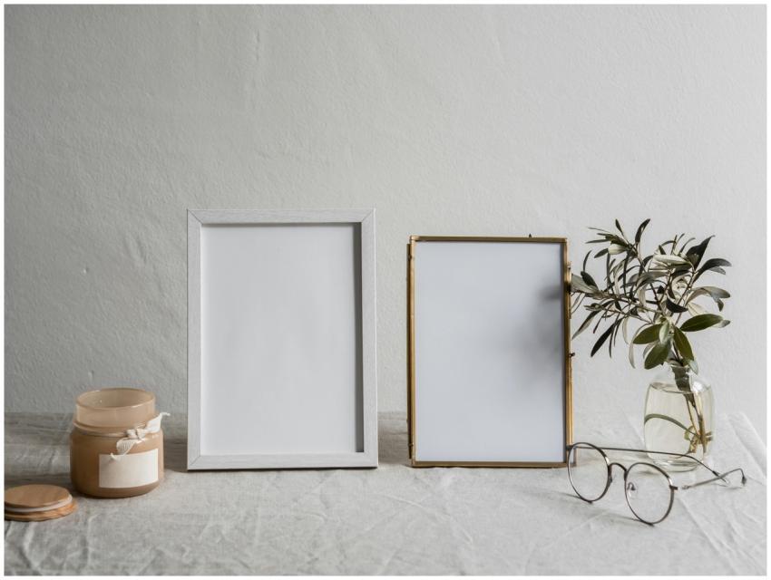 A serene minimalist still life featuring blank fra