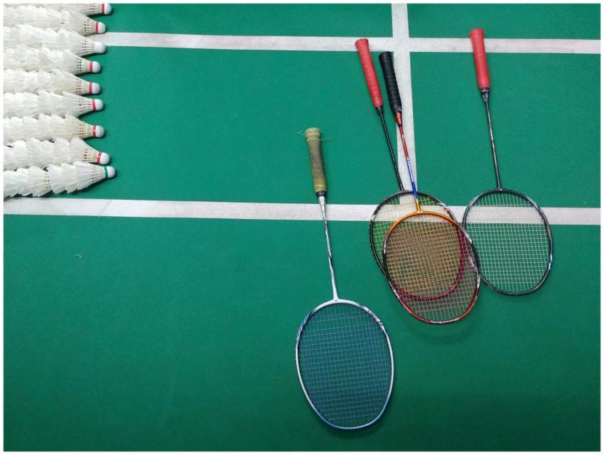 Top view of badminton rackets and shuttlecocks on