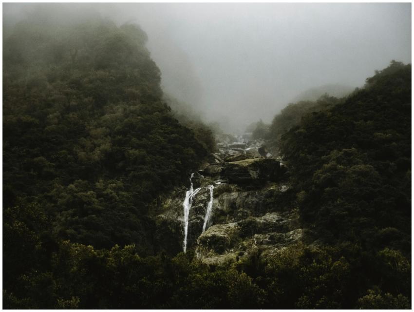 A dramatic view of a waterfall cascading through a