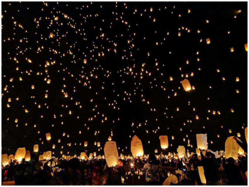 A mesmerizing scene of sky lanterns illuminating t