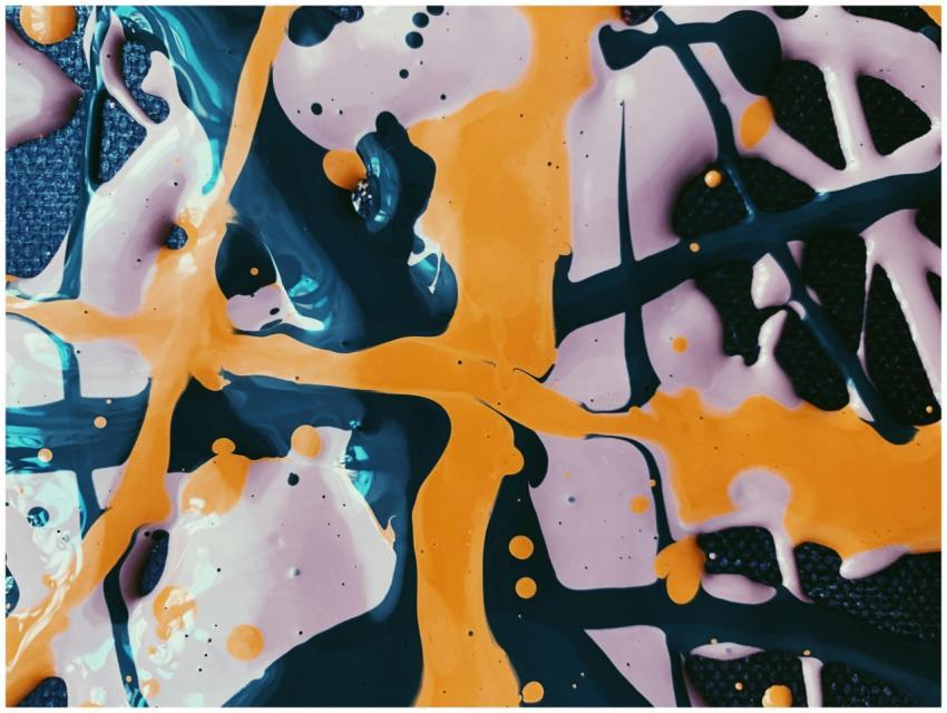 Dynamic abstract artwork with orange and blue spla