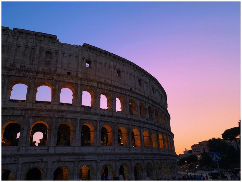 Stunning sunset over the Colosseum in Rome with vi