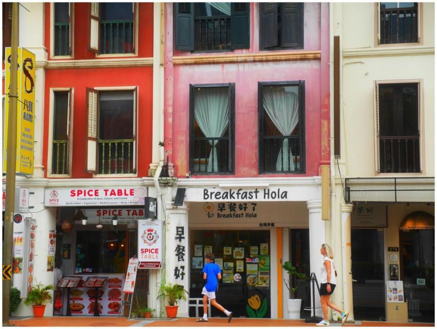 Vibrant city street with colorful buildings and sh