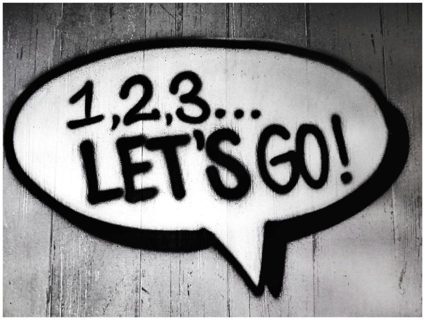 Black and white street art featuring a bold motiva