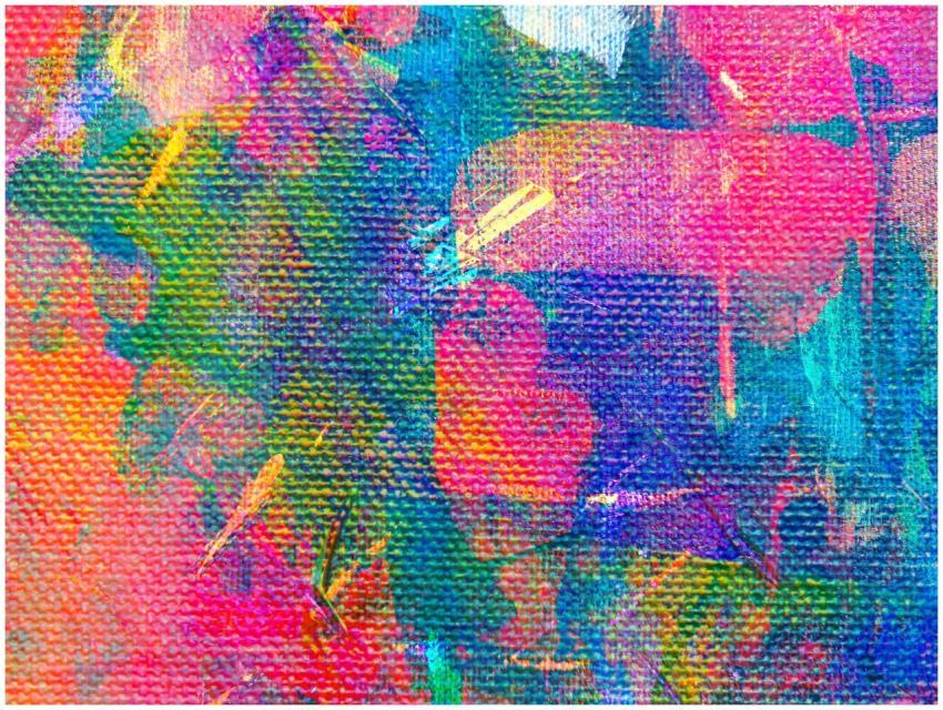 Close-up of a colorful abstract painting with text