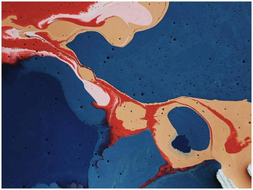 Vibrant abstract painting showcasing bold blue, re