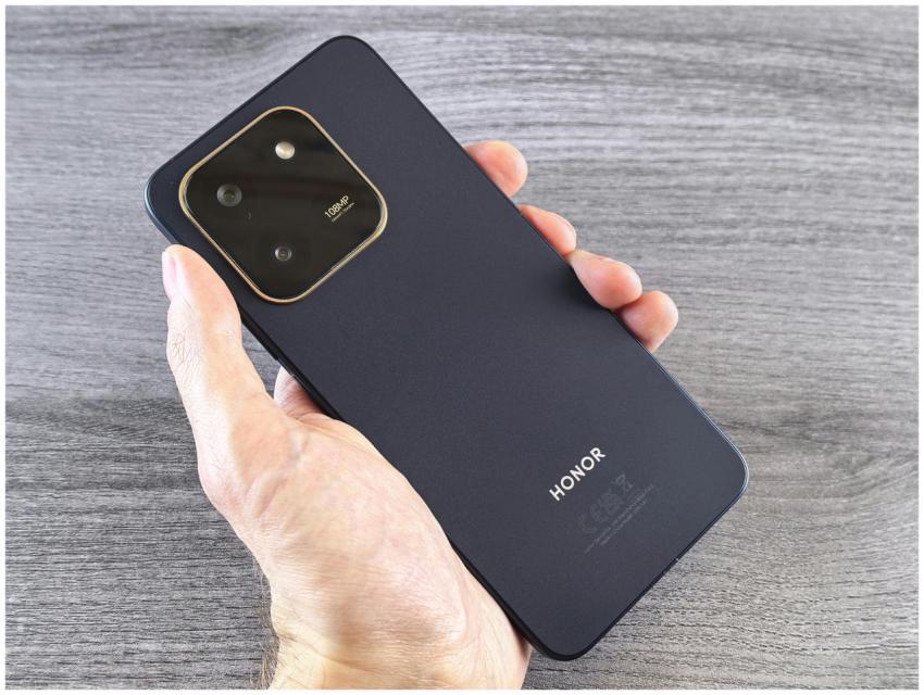 Detailed shot of a person holding a sleek smartpho