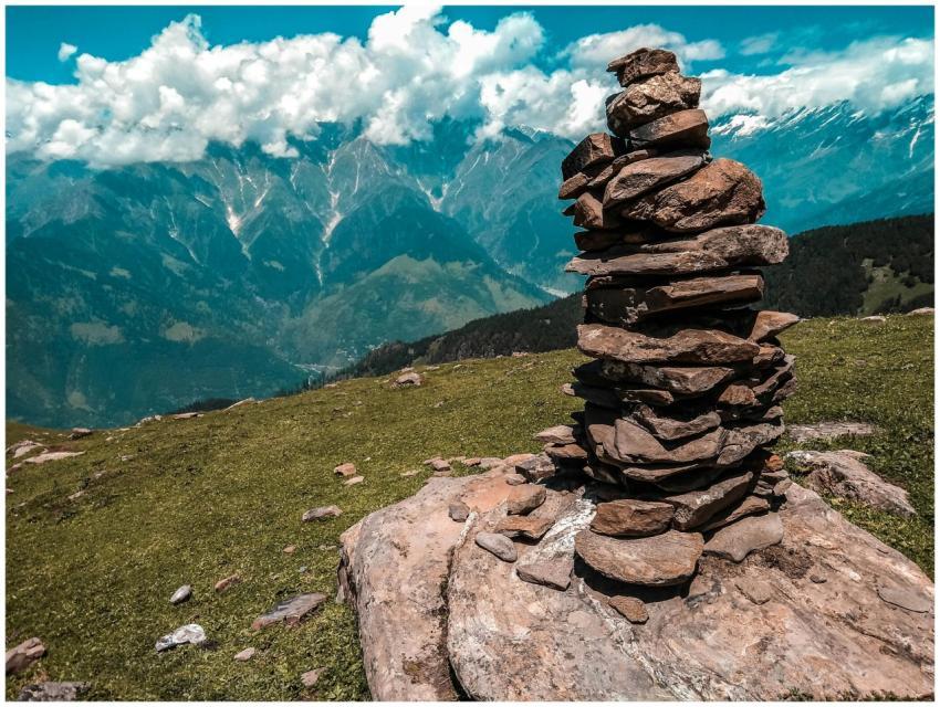 Stack of rocks with a stunning mountain landscape