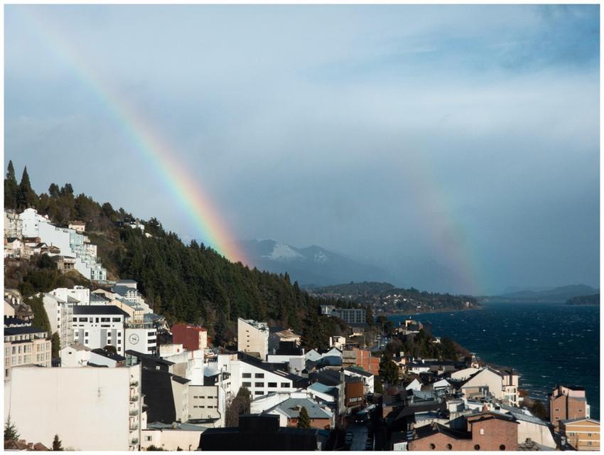 A vibrant rainbow graces the skies over San Carlos