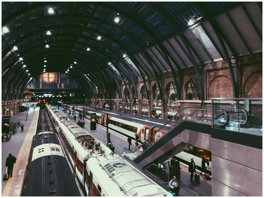 Dynamic view of a busy train station in England wi