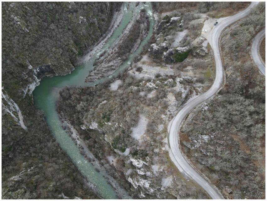 Stunning aerial view of a winding road and turquoi