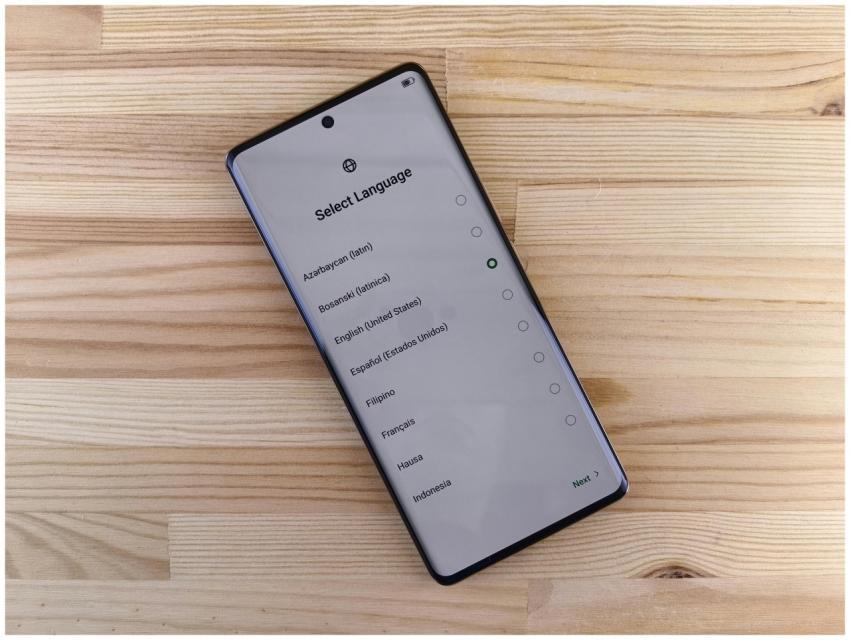 Close-up of smartphone with language selection scr