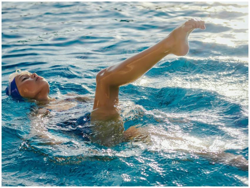 A female athlete gracefully floats while practicin