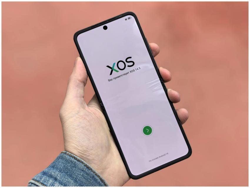 Close-up of a smartphone displaying the XOS 14.5 o