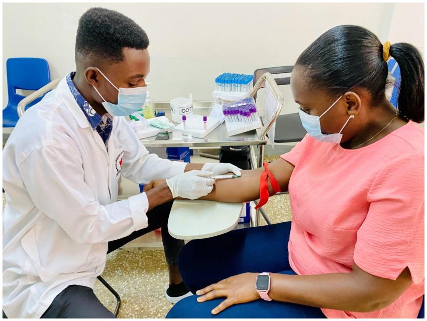 A healthcare worker administers an injection to a