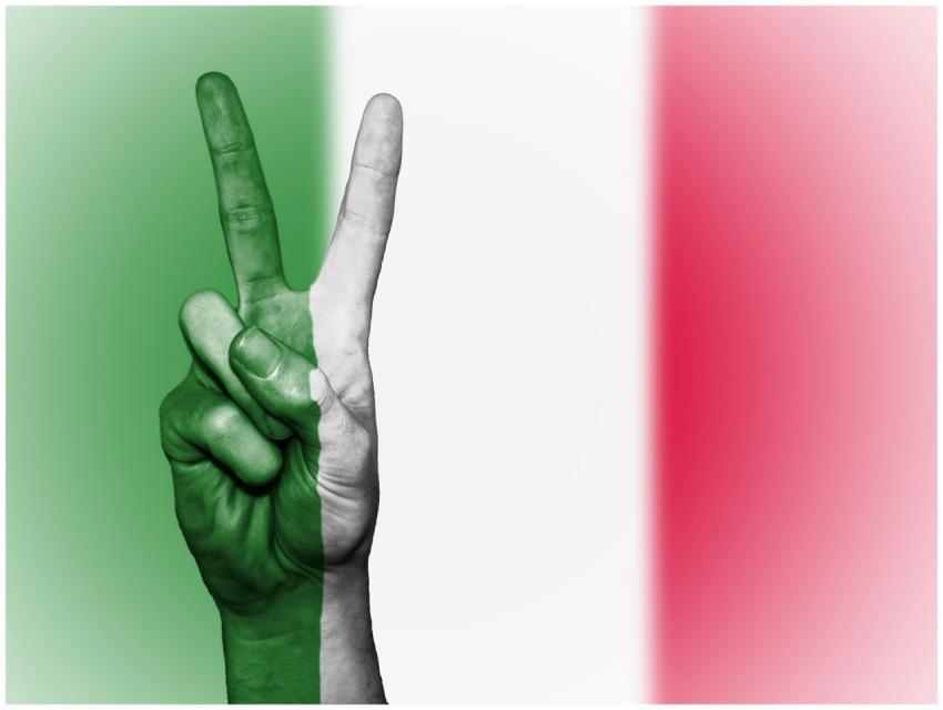 A peace sign gesture overlaid with the Italian fla